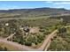 Beautiful aerial shot of home, featuring lush greenery and mountain views at 5800 Elk View Ct, Larkspur, CO 80118