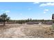 Expansive backyard backing to trees and showing a slice of the home's rear at 5800 Elk View Ct, Larkspur, CO 80118