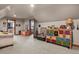 Spacious bonus room with carpeted floors, unique storage and playful decor at 5800 Elk View Ct, Larkspur, CO 80118