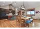 Charming dining area featuring wooden accents, unique lighting, and rustic charm at 5800 Elk View Ct, Larkspur, CO 80118