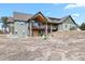 Back exterior shows spacious multi-level deck, walkout basement, and beautiful backyard at 5800 Elk View Ct, Larkspur, CO 80118