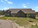 Inviting two-story home with a charming stone pathway leading to the front door at 5800 Elk View Ct, Larkspur, CO 80118