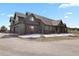 Stunning home exterior showcasing a spacious three-car garage and pristine landscaping at 5800 Elk View Ct, Larkspur, CO 80118