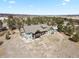 The home's sprawling back and outdoor living areas can be seen from this vantage point at 5800 Elk View Ct, Larkspur, CO 80118