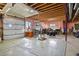 Spacious unfinished garage with large door and windows provides ample space for hobbies at 5800 Elk View Ct, Larkspur, CO 80118