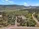 Expansive property featuring rolling hills, mature trees, and mountain views at 5800 Elk View Ct, Larkspur, CO 80118