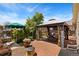 Outdoor living space showcasing a gazebo, landscaped patio, lush greenery, and outdoor seating at 9598 Lowell Blvd, Westminster, CO 80031