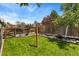 Well-maintained backyard featuring a lush green lawn, privacy fencing, and mature trees for outdoor enjoyment at 9598 Lowell Blvd, Westminster, CO 80031