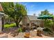 Backyard featuring a shed, a seating area, lush green lawn, and mature trees for outdoor enjoyment at 9598 Lowell Blvd, Westminster, CO 80031