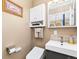 Cozy bathroom featuring a modern sink, toilet, and storage cabinet at 9598 Lowell Blvd, Westminster, CO 80031