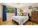 Comfortable bedroom with large window and hardwood floors at 9598 Lowell Blvd, Westminster, CO 80031