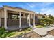 Inviting front porch with brick accents, pillars, and lovely landscaped features at 9598 Lowell Blvd, Westminster, CO 80031