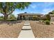 Charming ranch-style home featuring a landscaped front yard and stone walkway at 9598 Lowell Blvd, Westminster, CO 80031