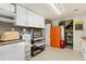 Organized garage with built-in cabinets, shelving, and storage space for a clutter-free and functional area at 9598 Lowell Blvd, Westminster, CO 80031