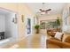 Bright living room featuring a comfortable seating area and front door at 9598 Lowell Blvd, Westminster, CO 80031