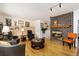 Cozy living room with a brick fireplace, hardwood floors, and comfortable seating at 9598 Lowell Blvd, Westminster, CO 80031