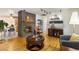 Open-concept living area with fireplace, hardwood floors, and great natural light at 9598 Lowell Blvd, Westminster, CO 80031