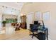 Spacious living room with vaulted ceilings and a cozy seating area next to a desk at 9598 Lowell Blvd, Westminster, CO 80031