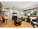 Bright living room with hardwood floors, large window, and neutral decor at 9598 Lowell Blvd, Westminster, CO 80031