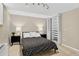 Cozy bedroom featuring neutral tones, a comfortable bed, and a built-in closet at 909 N Logan St # 1B, Denver, CO 80203