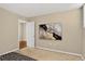 Inviting bedroom with light walls, carpet flooring and a stylish piece of artwork at 909 N Logan St # 1B, Denver, CO 80203