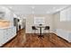 Eat-in kitchen area featuring hardwood floors and neutral decor, ready for casual meals and gatherings at 909 N Logan St # 1B, Denver, CO 80203