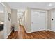 Inviting hallway features hardwood floors, neutral walls, and recessed lighting leading to various rooms at 909 N Logan St # 1B, Denver, CO 80203