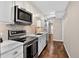 Modern kitchen featuring stainless steel appliances, sleek countertops, and ample cabinet space at 909 N Logan St # 1B, Denver, CO 80203