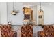 Stylish bar area with custom cabinetry, granite countertops, and unique lighting at 35 Brookhaven Pl, Littleton, CO 80123
