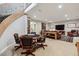 Spacious finished basement with game table and comfortable seating area at 35 Brookhaven Pl, Littleton, CO 80123