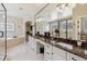 Large main bathroom with double sinks, vanity, granite countertops, and tile flooring at 35 Brookhaven Pl, Littleton, CO 80123