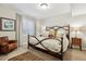 Comfortable bedroom with iron bed frame and neutral decor at 35 Brookhaven Pl, Littleton, CO 80123