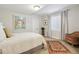 Bright bedroom with art, window, and comfortable chair at 35 Brookhaven Pl, Littleton, CO 80123