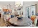 Open kitchen and dining area with wine cooler and view of great room stairs at 35 Brookhaven Pl, Littleton, CO 80123