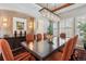 Stylish dining area with an ornate table set, modern chandelier and ample light at 35 Brookhaven Pl, Littleton, CO 80123