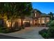 Beautiful home exterior with a spacious driveway and a well-manicured lawn at 35 Brookhaven Pl, Littleton, CO 80123