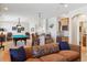 Game room featuring a pool table, wet bar, and ample seating at 35 Brookhaven Pl, Littleton, CO 80123