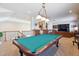 Game room with pool table, bar area, and open layout at 35 Brookhaven Pl, Littleton, CO 80123