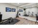 Home gym with weights, bench, wall mirror and workout equipment at 35 Brookhaven Pl, Littleton, CO 80123