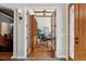 Elegant home office featuring wood floors, coffered ceilings, and built-in shelves for a professional and productive workspace at 35 Brookhaven Pl, Littleton, CO 80123