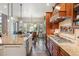 Gourmet kitchen featuring granite countertops, custom cabinetry, and stainless steel appliances, perfect for culinary enthusiasts at 35 Brookhaven Pl, Littleton, CO 80123