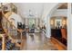Open-concept living space with high ceilings, stone floors, and a grand staircase at 35 Brookhaven Pl, Littleton, CO 80123