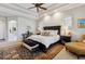 Spacious main bedroom suite featuring tray ceilings, a sitting area, and large windows at 35 Brookhaven Pl, Littleton, CO 80123