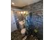 Stylish bathroom featuring modern tile, updated fixtures, and a decorative shower curtain at 6710 Clermont St, Commerce City, CO 80022