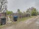 View of backyard with wooden fence and bins outside at 5703 Ammons St, Arvada, CO 80002