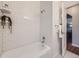 Bright bathroom with white subway tile, updated fixtures, and white-tiled floor at 5703 Ammons St, Arvada, CO 80002