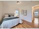 Relaxing bedroom with ample natural light, hardwood floors, and comfortable furnishings at 5703 Ammons St, Arvada, CO 80002