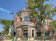The Homegrown Tap & Dough building featuring a modern design, street seating, and a welcoming entrance at 5703 Ammons St, Arvada, CO 80002