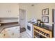 Functional kitchen layout with an oven, storage, and adjacent countertops, perfect for cooking prep at 5703 Ammons St, Arvada, CO 80002