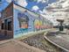 Exterior side of brick building with a unique mural at 5703 Ammons St, Arvada, CO 80002